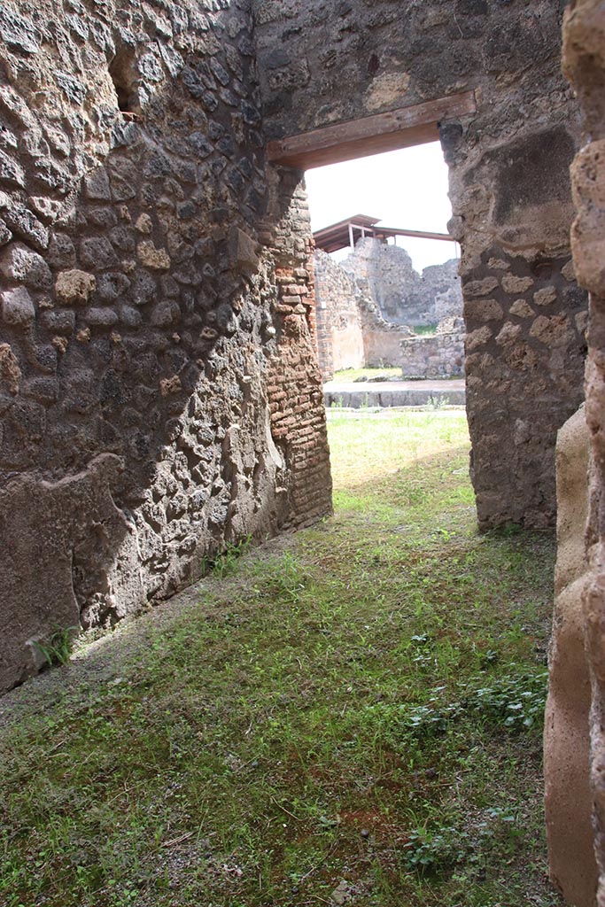 IX.6.1 Pompeii. October 2024. 
Looking south from entrance doorway across rear room into workshop. Photo courtesy of Klaus Heese.
