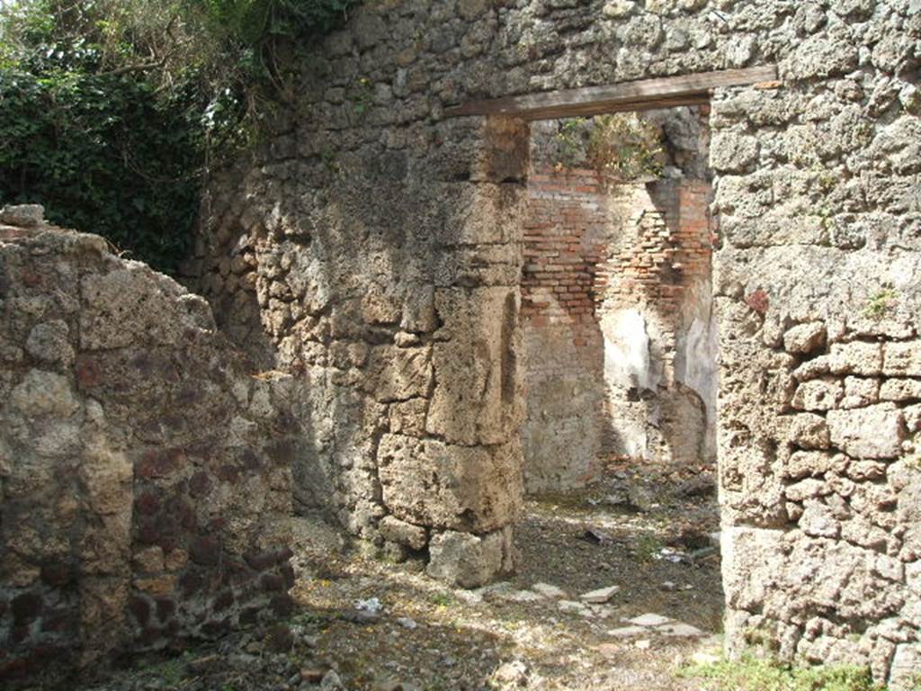 IX.7.19 Pompeii. May 2005. Looking west from room g, towards doorway leading into room b, the atrium, on right.