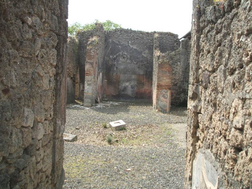 IX.7.25 Pompeii. May 2005. Looking south from fauces or entrance corridor “1”, across atrium “2” to tablinum, room “o”.
According to Della Corte, this spacious atrium, deprived of an upper floor, was adapted to the use of a hospitium and caupona.
The thermopolium, with the customary bench, was at number 24.
Here, the atrium, the kitchen, the two triclinia (installed in the tablinum and the ala), and various dormitories were destined for the use of a hotel.
Found in the atrium, was a graffito of a long list of foodstuffs, supplied to someone not known, but supplied on eight consecutive days.
This mentioned bread, wine, cheese, wine, oil, leeks, onions, beans, etc.  [CIL IV 5380]
See Della Corte, M., 1965.  Case ed Abitanti di Pompei. Napoli: Fausto Fiorentino. (p.197)

According to Cooley, the list seemed to record food, either sold or bought.
See Cooley, A. and M.G.L., 2004. Pompeii : A Sourcebook. London : Routledge. (p.163)

According to Epigraphik-Datenbank Clauss/Slaby (See www.manfredclauss.de), the graffito read as -

VIII Idus casium I 
pane(m) VIII 
oleum III 
vinum III 
VII Idus 
pane(m) VIII 
oleum V 
cepas V /
pultarium I 
pane(m) puero II 
vinum II 
VI Idus pane(m) VIII 
puero pane(m) IV 
halica III 
V Idus 
vinum domatori |(denarius) 
pane(m) VIII vinum II casium II 
IV Idus 
Hxeres |(denarius) pane(m) II 
femininum VIII 
tri<t=D>icum |(denarius) I 
bubella(m) I palmas I 
thus I casium II 
botellum I 
casium molle(m) IV 
oleum VII 
Servato 
montana |(denarius) I 
oleum |(denarius) I VIIII 
pane(m) IV casium IV 
porrum I 
pro patella I 
sittule(m) VIIII 
inltynium I 
III Idus pane(m) II 
pane(m) puero II 
pri(die) Idus 
puero pane(m) II 
pane(m) cibar(em) II 
oleum V 
halica(m) III 
domato[ri] pisciculum II       [CIL IV 5380]