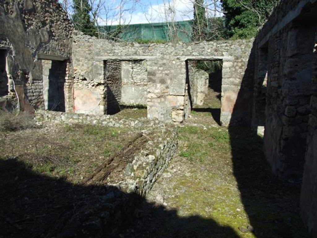 IX.9.13 Pompeii.  March 2009.  Looking east across south passageway of Room 6, Garden area.  Looking towards entrance passageway.