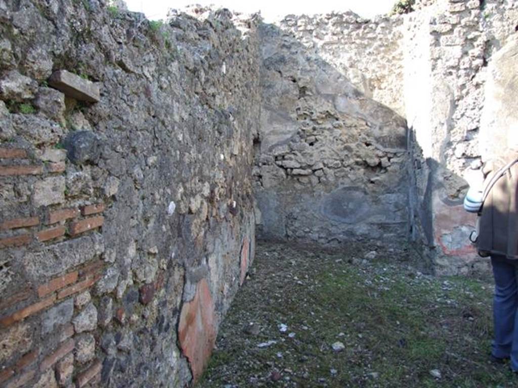 IX.9.13 Pompeii.  March 2009.  Looking north along west side of Room 6, Garden, towards Room 10. Latrine.