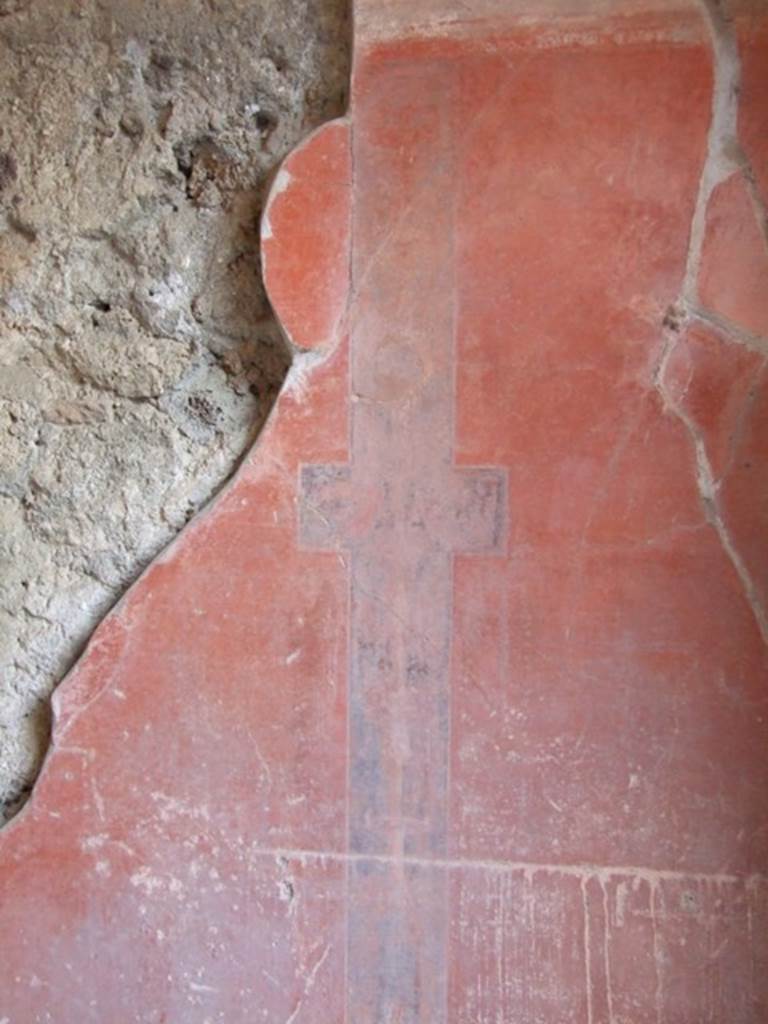 IX.9.c Pompeii. March 2009. Candelabrum in a narrow black panel on red north wall of triclinium.
