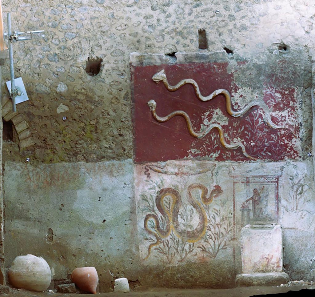 IX.10.1 Pompeii. September 2023. Lararium and altar recently found in room 12. 
Photo of the south wall of the lararium (12).
The lararium is structured on two superimposed registers with an upper register decorated with stucco and a lower register decorated with frescoes.
Fotopiano della parete sud del larario (12).
La rappresentazione è strutturata su due registri sovrapposti con un registro superiore decorato a stucco ed uno inferiore decorato ad affresco.
See PAP e-journal 6, 28.09.2023, p. 64, fig. 10. Download: PAP e-journals 2023 collection volumes 01-09 
Photograph © Parco Archeologico di Pompei.

