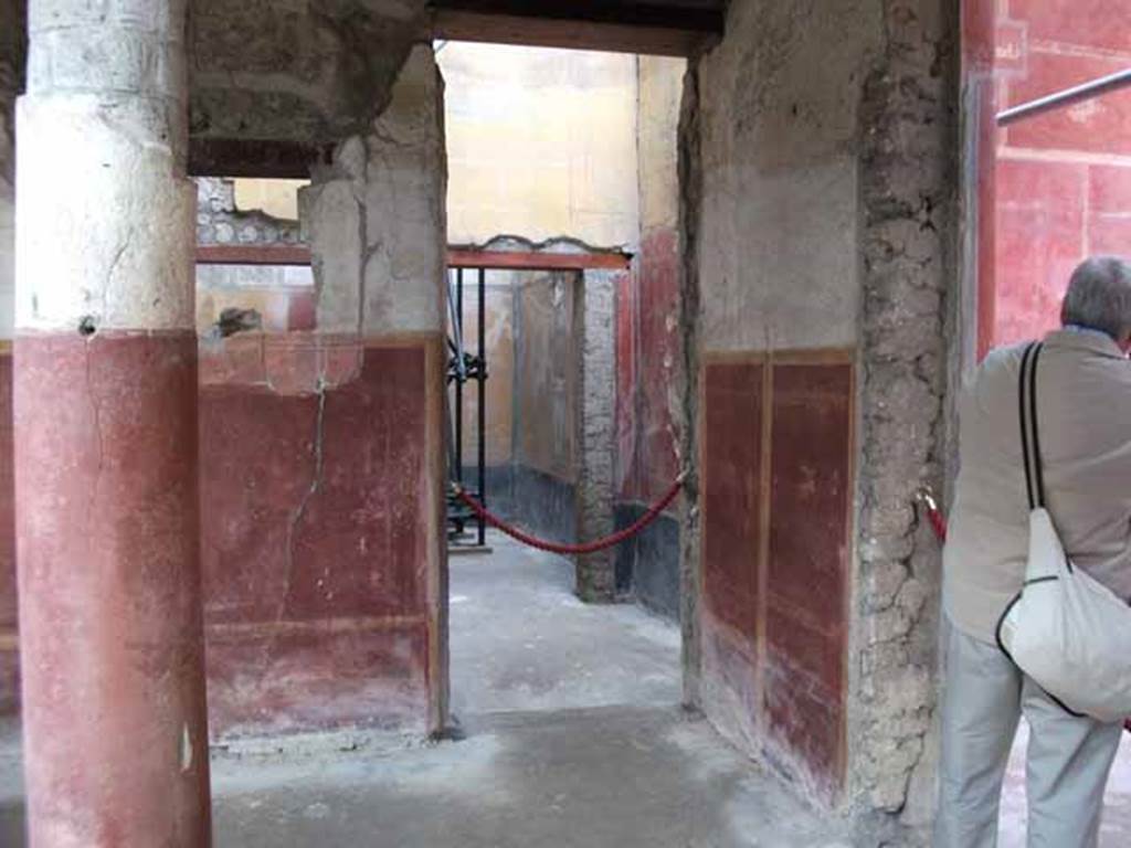 IX.12.9 Pompeii. May 2010. Doorway to room 11, in centre, in north-east corner of portico.