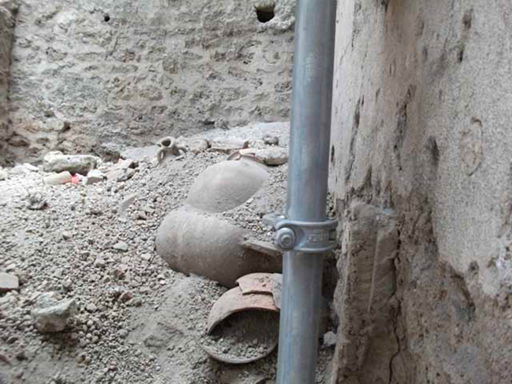 IX.12.9 Pompeii. May 2010. Room 17, looking south into unexcavated room with amphorae.