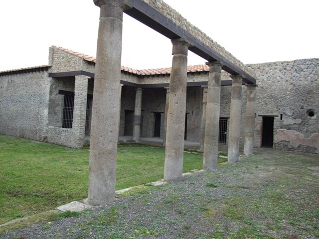 IX.14.4 Pompeii. December 2007. Peristyle 1, looking across north portico to rooms 3 (on left), 5, staircase (m), 12, 13, 14 and 15. 
