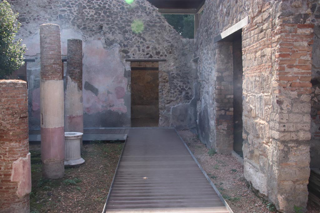 HGW24 Pompeii. Villa of Diomedes. October 2023. 
Looking south towards doorway in south-west corner of peristyle. Photo courtesy of Klaus Heese.
