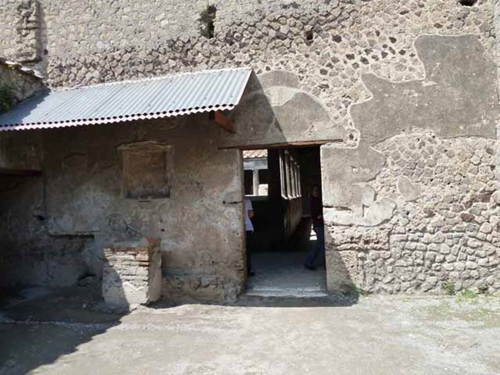 Villa of Mysteries, Pompeii. May 2010.  Room 61, north wall with doorway to peristyle C.