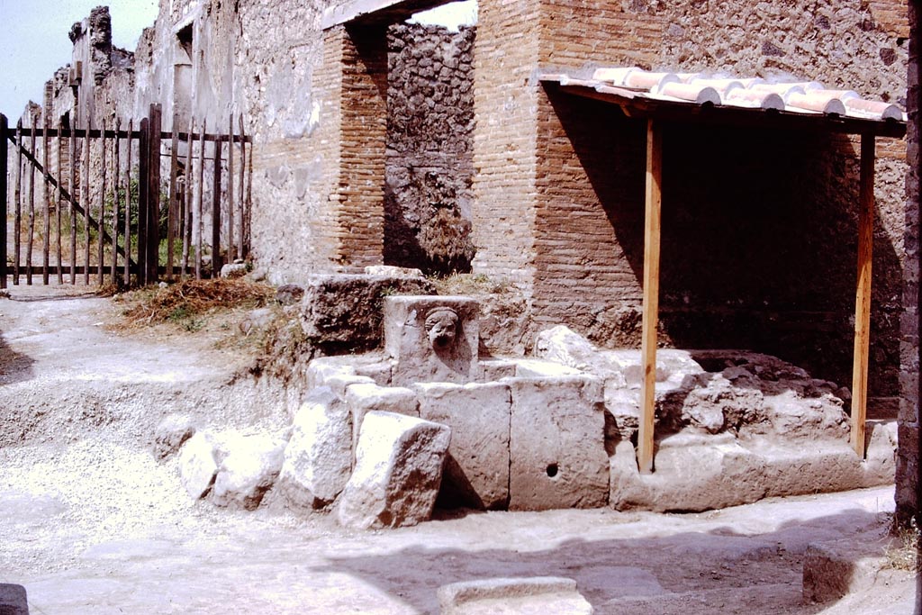 Via di Nocera, west side, Pompeii. 1972. 
Looking west towards fountain at junction with Via di Castricio. Photo by Stanley A. Jashemski. 
Source: The Wilhelmina and Stanley A. Jashemski archive in the University of Maryland Library, Special Collections (See collection page) and made available under the Creative Commons Attribution-Non Commercial License v.4. See Licence and use details.
J72f0398
