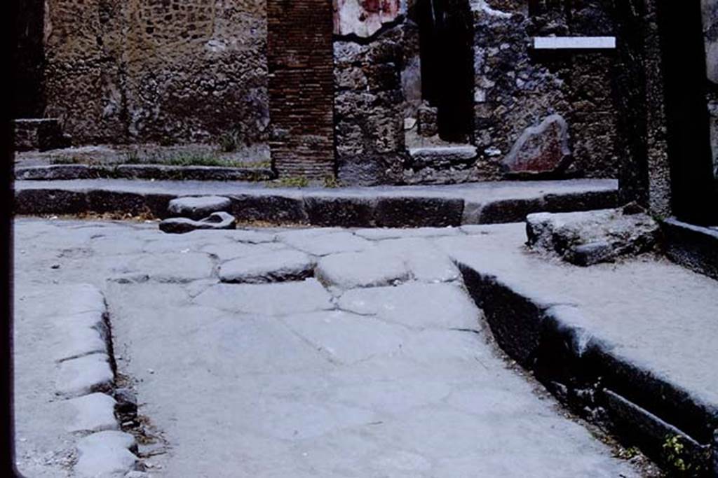 Vicolo del Lupanare, Pompeii. 1966. Looking north at junction with Via degli Augustali. 
Photo by Stanley A. Jashemski.
Source: The Wilhelmina and Stanley A. Jashemski archive in the University of Maryland Library, Special Collections (See collection page) and made available under the Creative Commons Attribution-Non Commercial License v.4. See Licence and use details.
J66f0475
