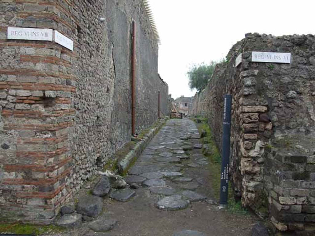 Vicolo della Fullonica, May 2010. Looking south between VI.8 and VI.6. from Vicolo di Mercurio.