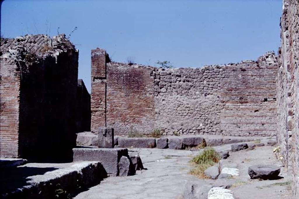 Vicolo della Regina, Pompeii, (turns to the left, behind the fountain). 1968. Looking west to junction with Vicolo dei Dodici Dei (on right), from near VIII.2.29. Photo by Stanley A. Jashemski.
Source: The Wilhelmina and Stanley A. Jashemski archive in the University of Maryland Library, Special Collections (See collection page) and made available under the Creative Commons Attribution-Non Commercial License v.4. See Licence and use details.
J68f1063
