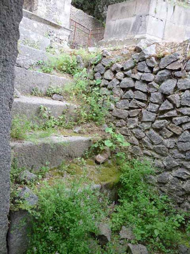 Pompeii Porta Nocera Tomb 11OS. May 2010.
Lava stone stairs from doorway to terrace. 
