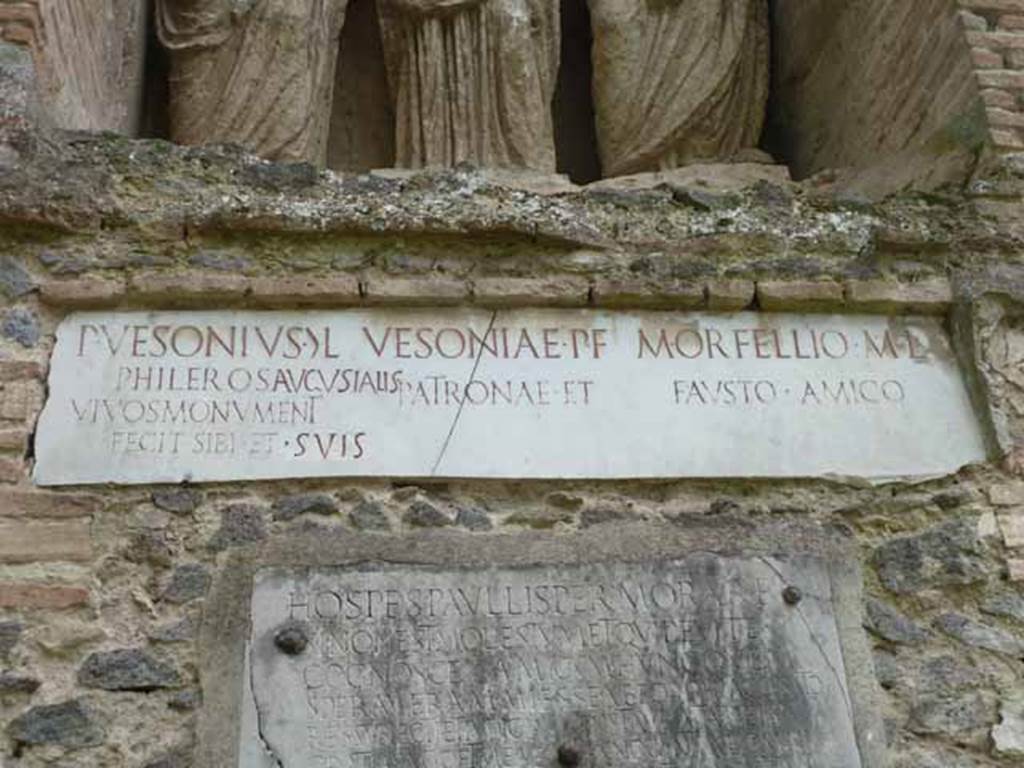 Pompeii Porta Nocera Tomb 23OS. May 2010.
Marble plaque with latin inscriptions.
P(ublius)  VESONIVS  G(aiae)  L(ibertus)
PHILEROS  AVGVSTALIS
VIVOS  MONVMENT(um)
FECIT  SIBI  ET  SVIS

VESONIAE  P(ubli)  F(iliae)
PATRONAE  ET

M(arco)  ORFELLIO  M(arci)  L(iberto)
FAVSTO  AMICO.
