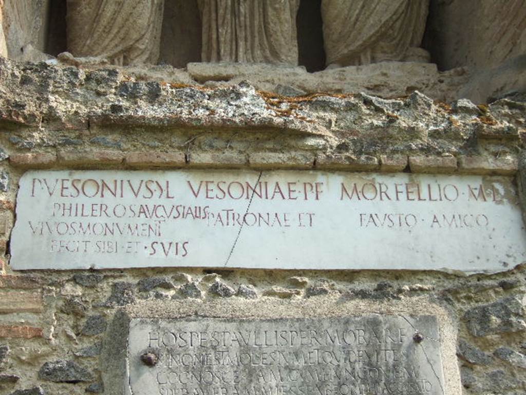 Pompeii Porta Nocera Tomb 23OS. Marble plaques with Latin inscriptions. May 2006.
According to Cooley, Vesonius erected the tomb during his lifetime and had to add Augustalis later on.
He had a life of ups and downs if we are to take seriously the message inscribed below, on the
Podium. This message is a curious variation on customary entreaties to a passer-by to stay
awhile in order to read an epitaph.
See Cooley, A. and M.G.L., 2004. Pompeii: A Sourcebook. London: Routledge, p. 152.
