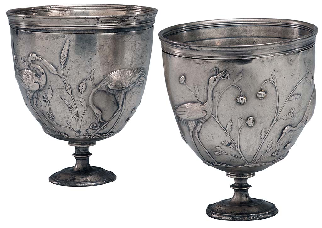 Villa della Pisanella, Boscoreale. Pair of silver cups with cranes in relief.
According to the Morgan Library, each cup consists of an inner liner and an outer casing, which is worked in repoussé. 
The original silver gilt has largely worn away, and the double handles are missing. 
There are guide marks for placing of handles in Greek letters.
The decoration consists of cranes feeding among wheat or sorghum, hunting snakes, a lizard, butterflies, and a grasshopper. 
On one side of one cup, the birds stand beside poppies.
Although the cups were found in Rome, the are believed to be the work of a Greek craftsman.
Probably from the Villa Maxima (=Villa Pisanella) at Boscoreale.
See https://www.themorgan.org/objects/item/161025
Now in The Morgan Library and Museum, New York. Purchased by J.P. Morgan, inventory number AZ050-1 and AZ050-2.
