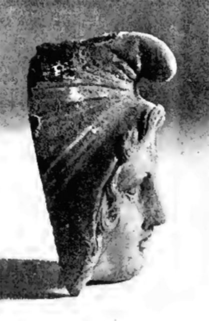 Villa of T. Siminius Stephanus, fondo Barbatelli. November 1899.  Front view of the bust of Paris wearing a Phrygian cap. On the 24th day, at a depth of 3.80m, found between the ash layers was a bronze protome of Paris, very well shaped, with Phrygian cap, ringed hair and silver eyes, whose eye-ball was made of glass paste: height  80mm. See Notizie degli Scavi di Antichità, 1899, p439, fig 1b.