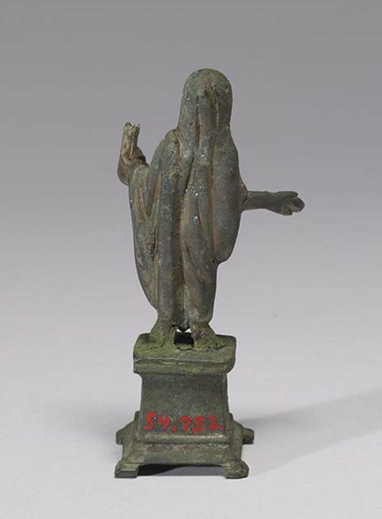Boscoreale, Villa rustica in fondo D’Acunzo. Room 12, lararium. 
Bronze statuette of sacrificing priest or genius familiaris, rear view.
Photo courtesy of The Walters Art Museum, Baltimore. Inventory number 54.752.
http://thewalters.org/
Creative Commons Attribution-ShareAlike 3.0 Unported Licence
