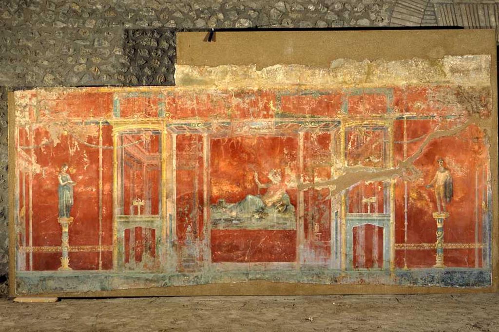 Complesso dei triclini in località Moregine a Pompei. September 2015. Triclinium C, north wall.
Nude male offeror with plate in right hand and bow in left.
