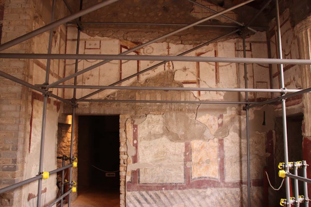 Oplontis Villa of Poppea, October 2020. 
Room 4, west wall with doorway to room 9, on left and entrance to corridor 6 to the west portico, on right. 
Photo courtesy of Klaus Heese.
