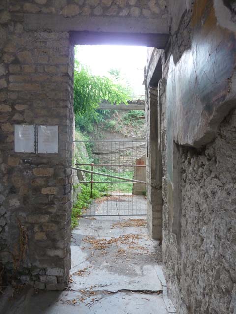 Oplontis, September 2015. Looking west along corridor on south side of atrium, room 5, leading to portico 13, and peristyle19. Doorway to room 11, a cubiculum, can be seen in the centre right.
