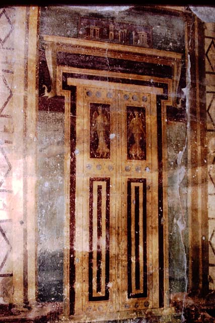 Oplontis, 1973. Room 5, painted doorway in the southern atrium. Photo by Stanley A. Jashemski. 
Source: The Wilhelmina and Stanley A. Jashemski archive in the University of Maryland Library, Special Collections (See collection page) and made available under the Creative Commons Attribution-Non Commercial License v.4. See Licence and use details. J73f0370
