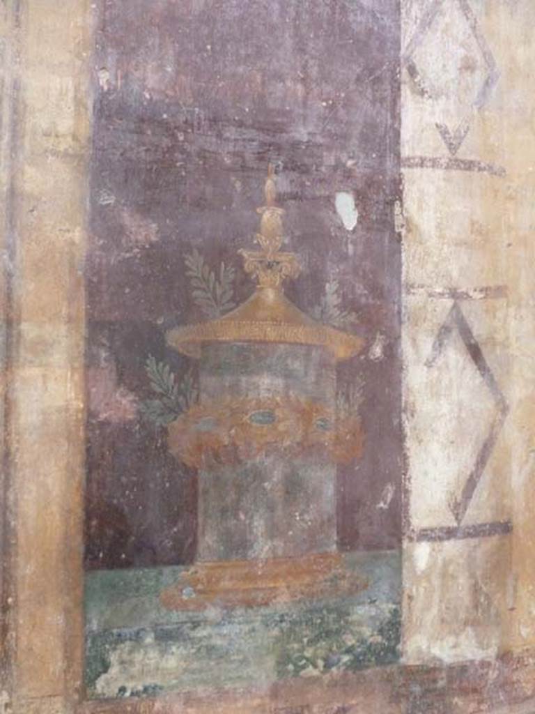 Oplontis, May 2010. Room 5, detail from painted doorway at north end of west wall. Photo courtesy of Buzz Ferebee.