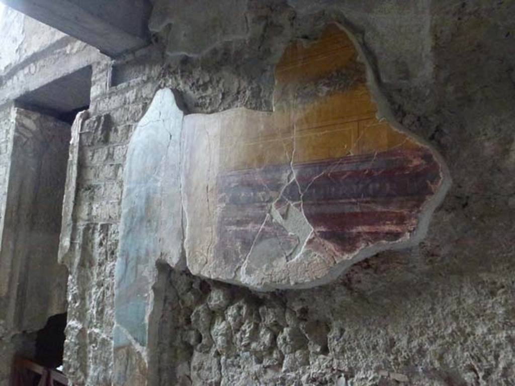 Oplontis, May 2010. Room 11, detail of painted decoration on east side of doorway in south corridor. Photo courtesy of Buzz Ferebee.
