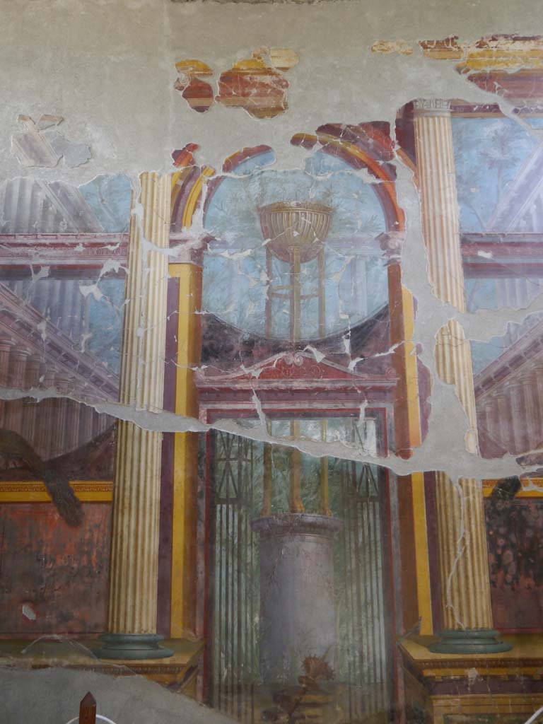Oplontis Villa of Poppea, September 2021.   
Room 15, detail of painting of the Delphic tripod on east wall. Photo courtesy of Klaus Heese.
