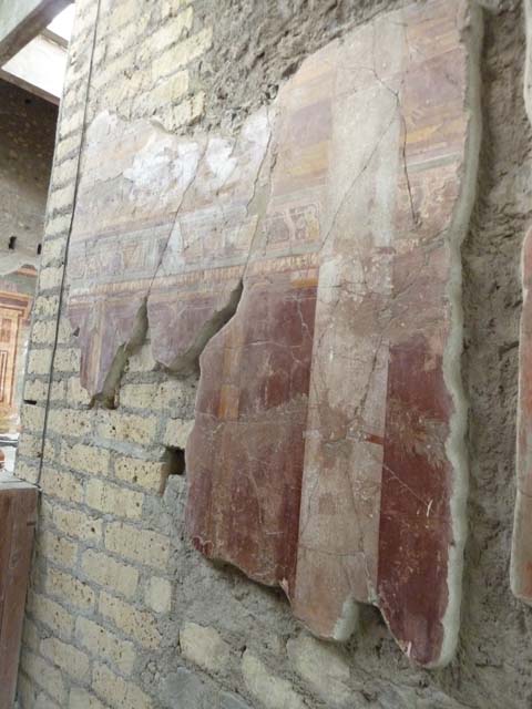 Oplontis, May 2011. Room 23, detail of painted decoration above doorway in portico 24.  Photo courtesy of Michael Binns.

