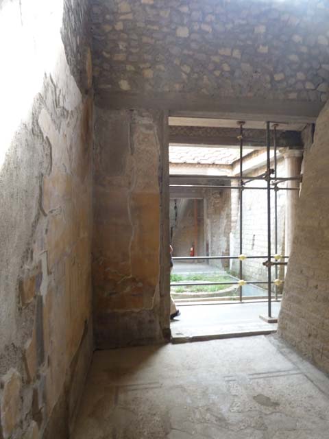 Oplontis, September 2015. Room 31, restoration of plaster on east wall, in north-east corner above doorway. 