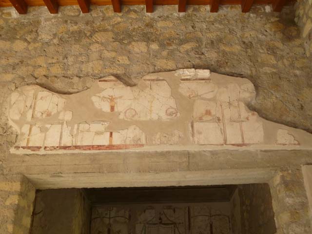 Oplontis, May 2011. Room 41, painted decoration on west and north wall of the alcove on the west side of the room. The small doorway leads into room 38. Photo courtesy of Michael Binns.

