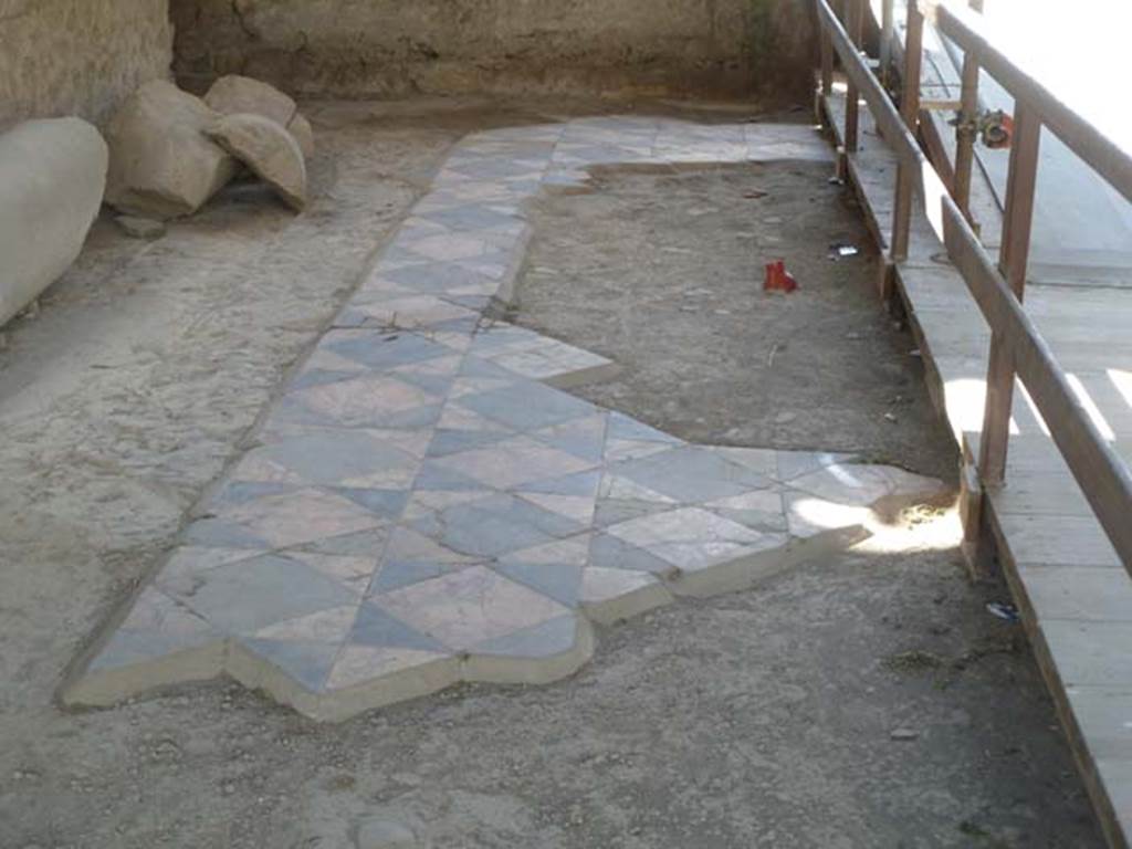 Oplontis, May 2011. Room 69, with decorative floor of opus sectile, looking west on south side. Photo courtesy of Michael Binns.