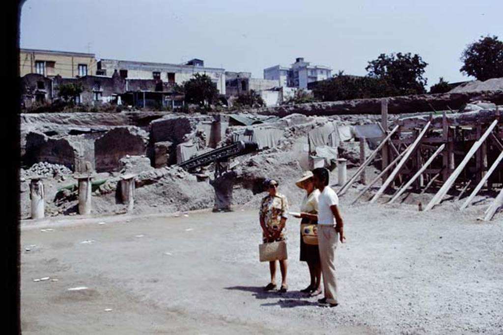 Oplontis, 1975. Looking north-east from area 59 the south-east peristyle, towards the rooms on the east side of the villa. Photo by Stanley A. Jashemski.   
Source: The Wilhelmina and Stanley A. Jashemski archive in the University of Maryland Library, Special Collections (See collection page) and made available under the Creative Commons Attribution-Non Commercial License v.4. See Licence and use details. J75f0479

