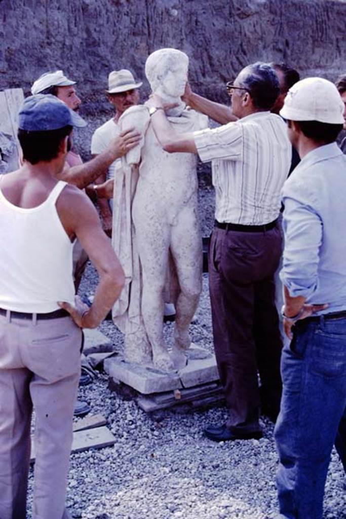 Oplontis, 1978. The statue of an ephebos re-united with his head. 
Photo by Stanley A. Jashemski.   
Source: The Wilhelmina and Stanley A. Jashemski archive in the University of Maryland Library, Special Collections (See collection page) and made available under the Creative Commons Attribution-Non Commercial License v.4. See Licence and use details.
J78f0046
