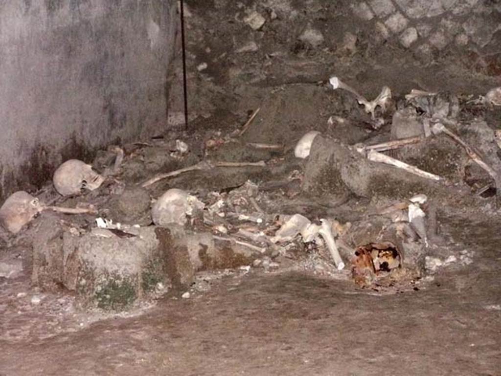 Oplontis, Villa of Lucius Crassius Tertius. March 2005. Remains of skeletons in room 10 on south side. 
Photo courtesy of Massimo Gravili.
