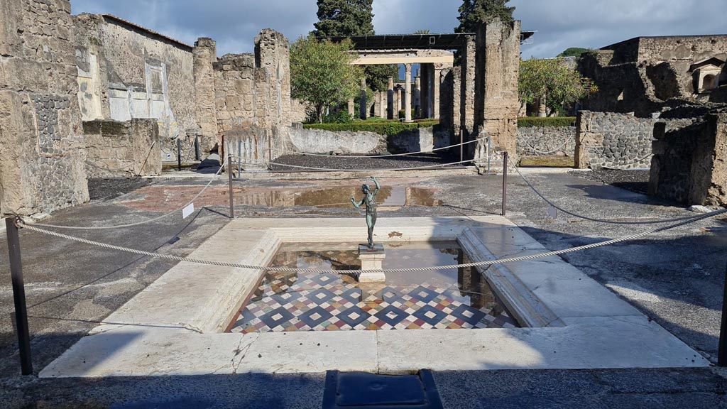 VI.12.2 Pompeii. April 2022. Looking north across impluvium in atrium towards tablinum. Photo courtesy of Giuseppe Ciaramella.