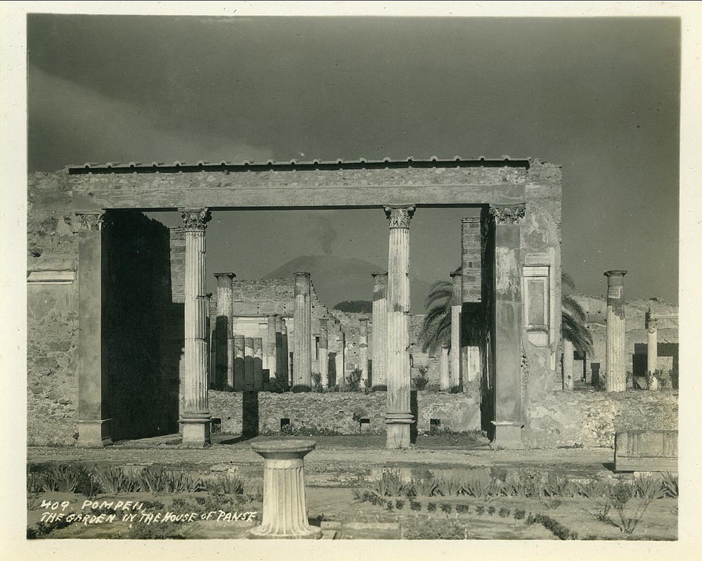 VI.12.2 Pompeii. 1932. Looking north from first garden across exedra to rear peristyle.
(Note: the photo has the wrong location being described as “The garden of the House of Panse”). 
Photo taken during a shore-visit from the ship Resolute’s world cruise in 1932.  Photo courtesy of Rick Bauer.
