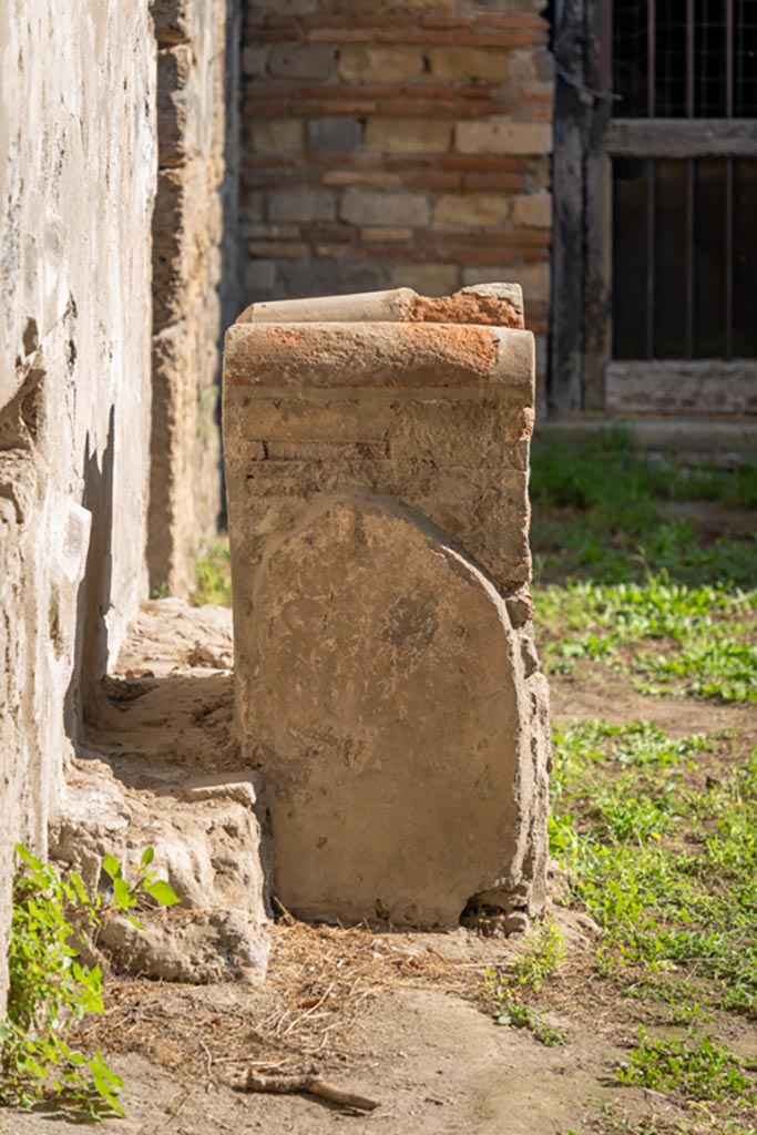 Villa of Mysteries, Pompeii. October 2023. 
Room 61, Looking east towards side of altar on north side of kitchen courtyard. 
Photo courtesy of Johannes Eber.
