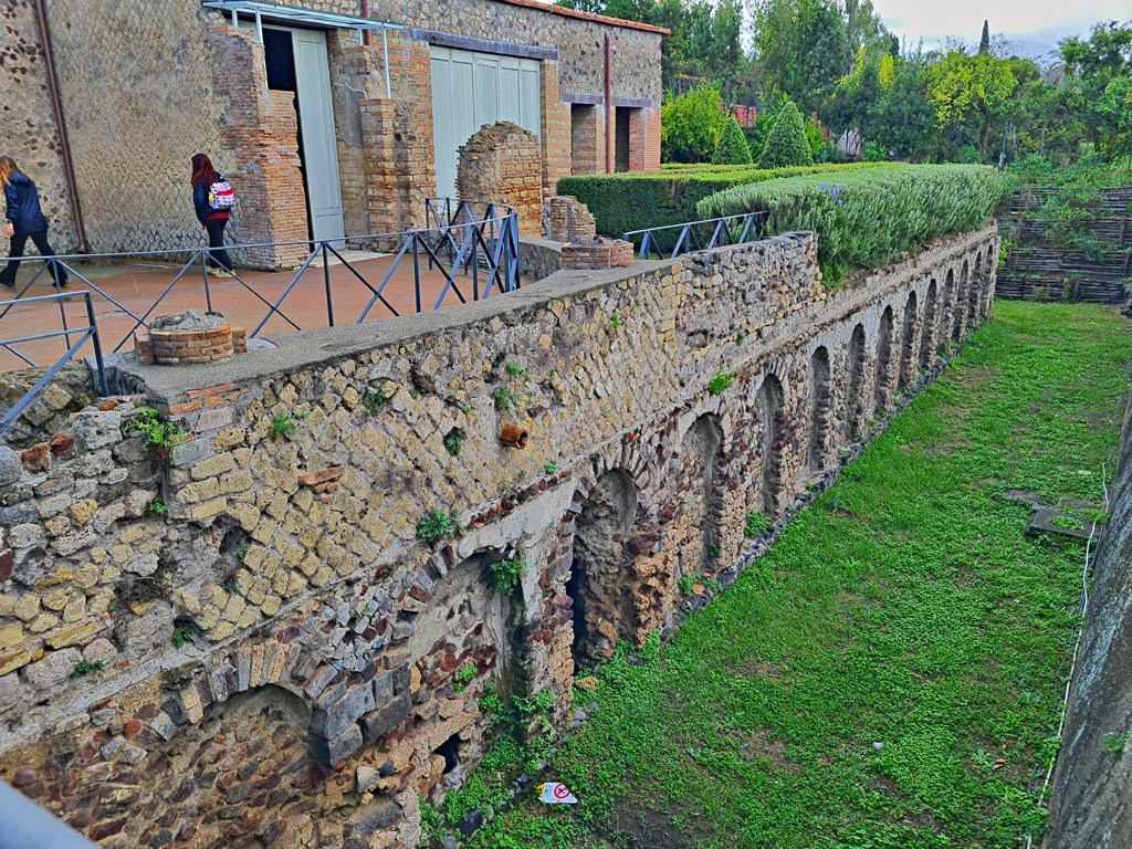 Villa of Mysteries, Pompeii. November 2023. 
Looking south-east across exedra towards doorway to portico P2. Photo courtesy of Giuseppe Ciaramella.
