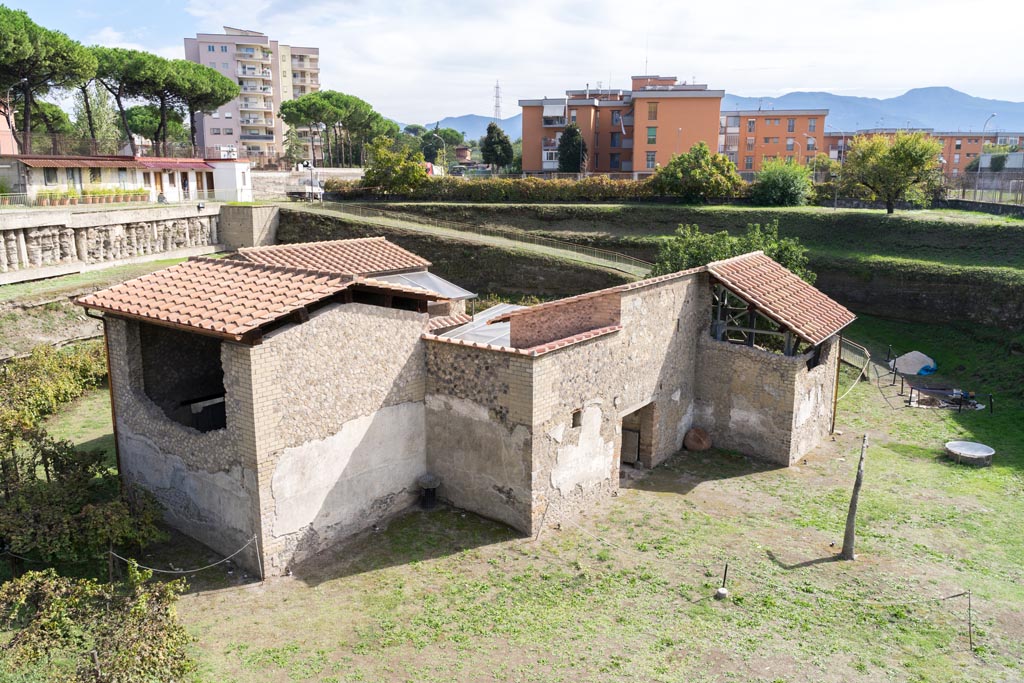 Villa Regina, Boscoreale. October 2021. 
Looking east along the south side, towards entrance doorway XIV, centre right. Photo courtesy of Johannes Eber.
