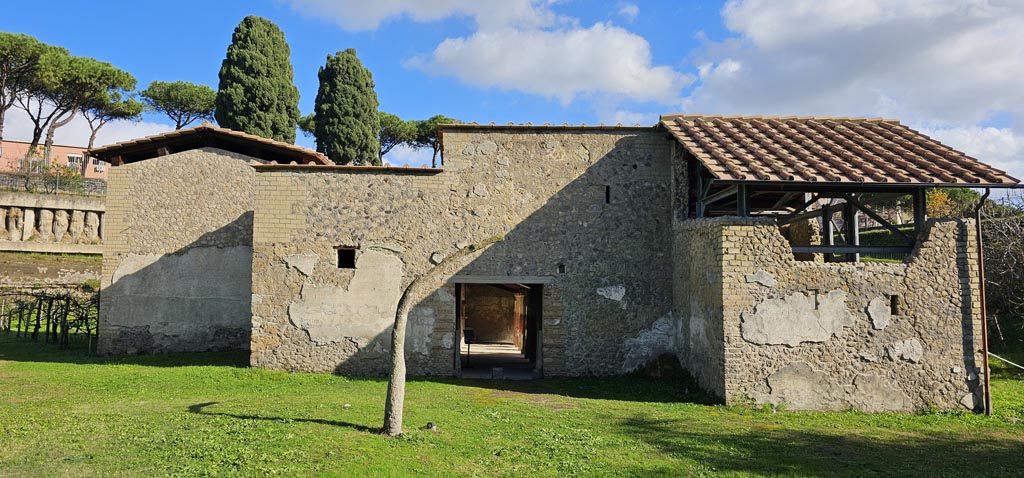 Villa Regina, Boscoreale. December 2023. 
Looking towards entrance doorway XIV on south side of villa. Photo courtesy of Miriam Colomer.

